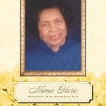 Memorial portrait of a woman in a blue dress with a gold frame.