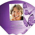 Memorial fan with a smiling woman's photo and purple butterflies.